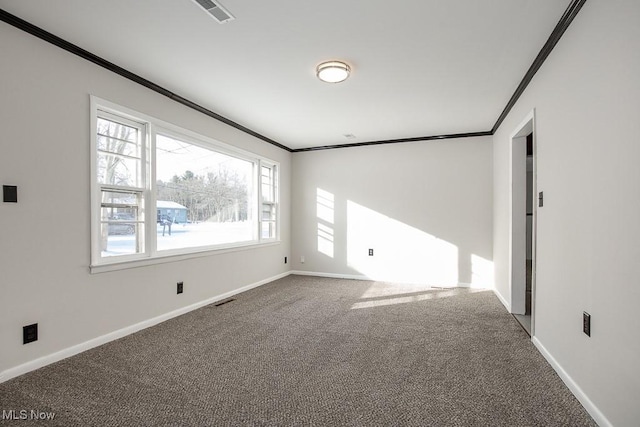 carpeted spare room with crown molding