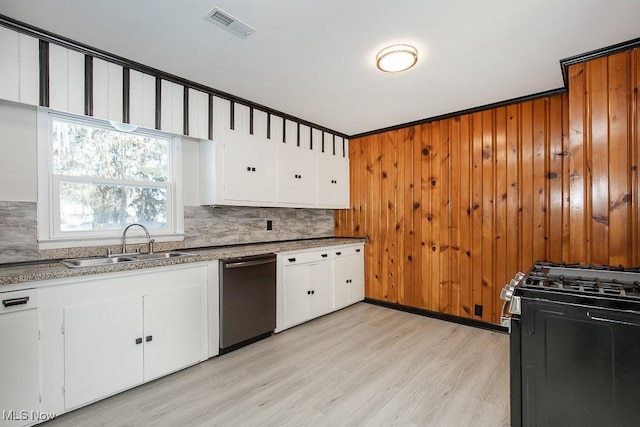 kitchen with white cabinetry, stainless steel appliances, sink, ornamental molding, and light wood-type flooring