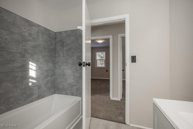 bathroom featuring hardwood / wood-style floors and vanity