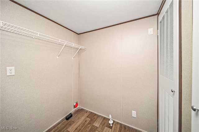 washroom featuring ornamental molding and hardwood / wood-style floors