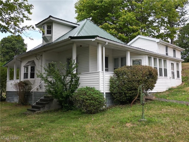 view of property exterior with a lawn