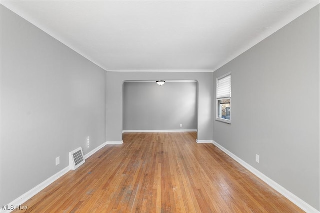 unfurnished room with light hardwood / wood-style floors