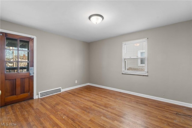 empty room with light wood-type flooring