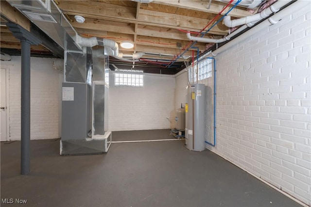 basement with heating unit, brick wall, and water heater