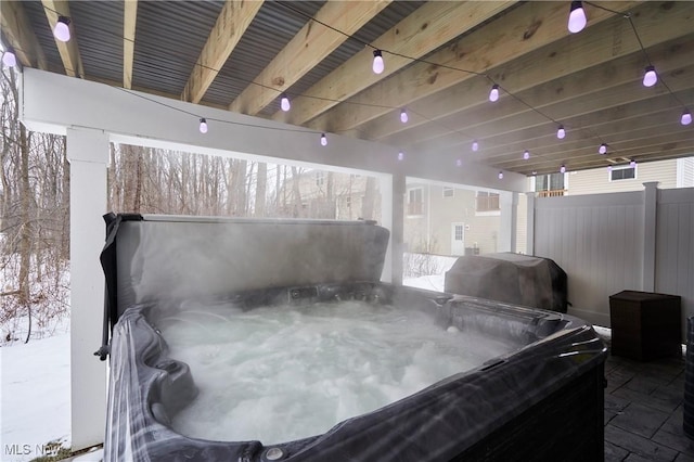 view of patio with a grill and a hot tub