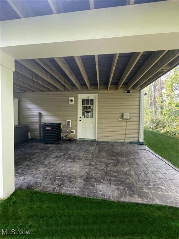 view of patio / terrace featuring a carport and central AC