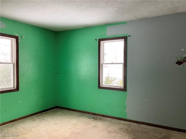 empty room featuring a textured ceiling