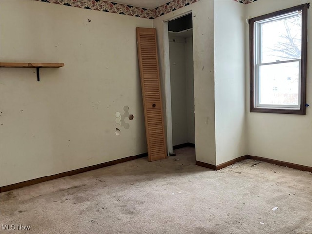 unfurnished bedroom with light carpet