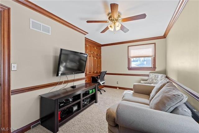 carpeted living room with crown molding and ceiling fan