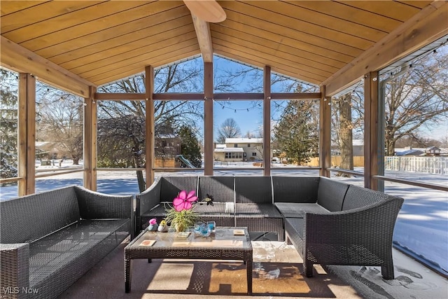 sunroom with wood ceiling and vaulted ceiling with beams