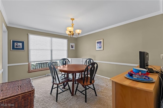 carpeted dining space with a notable chandelier and ornamental molding