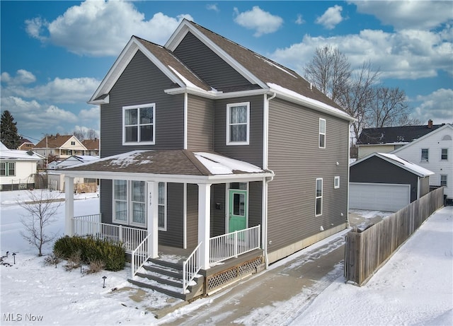 view of front of house featuring an outdoor structure, a porch, and a garage