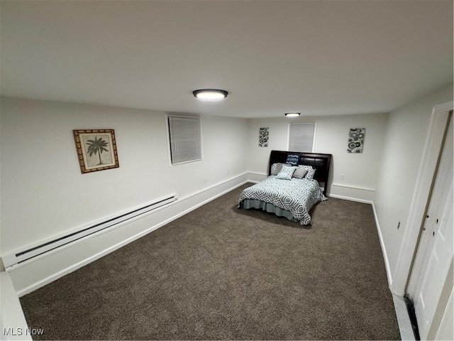 carpeted bedroom featuring a closet and baseboard heating