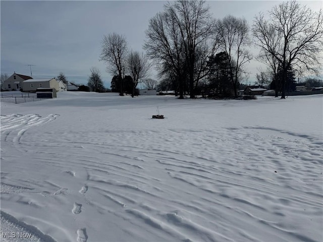 view of yard layered in snow