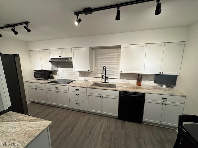 kitchen with sink, white cabinets, and black appliances