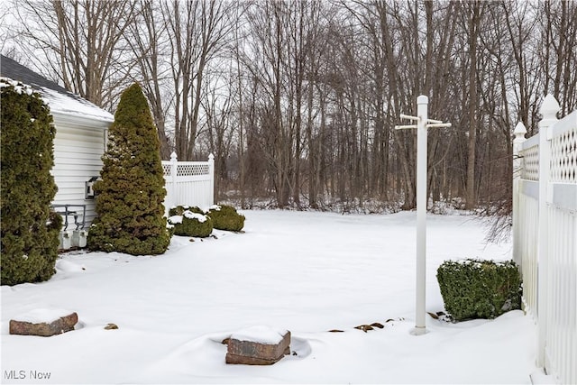 view of yard covered in snow