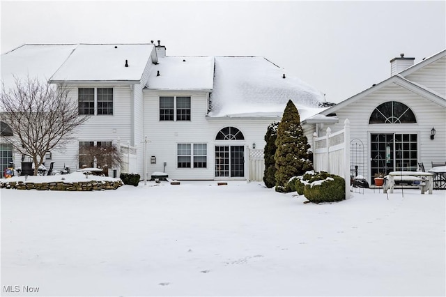 view of snow covered house