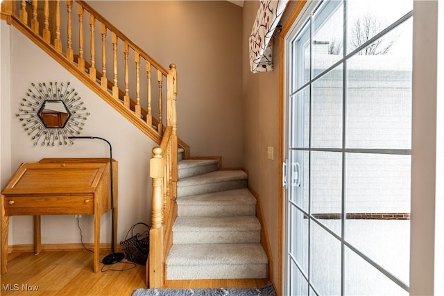 stairway featuring hardwood / wood-style floors