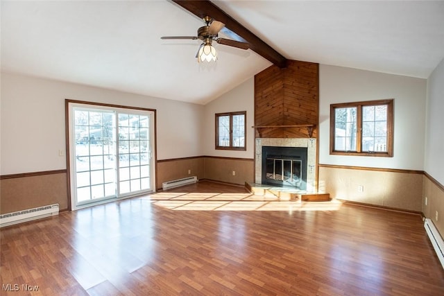 unfurnished living room with a fireplace, baseboard heating, light hardwood / wood-style flooring, and vaulted ceiling with beams