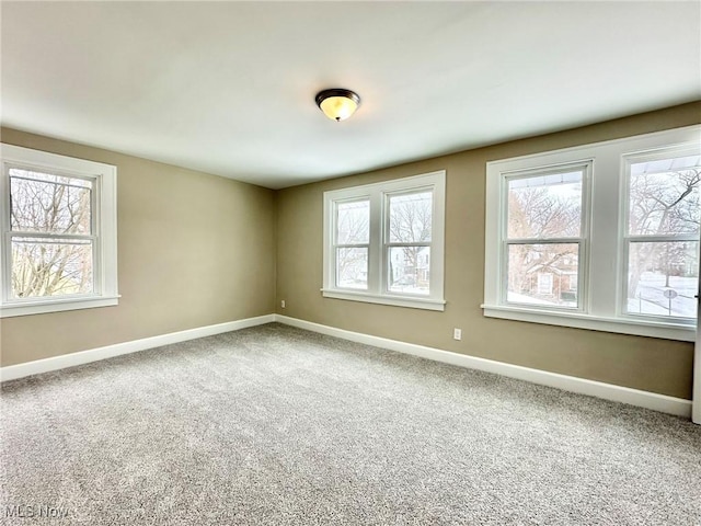 unfurnished room with carpet flooring