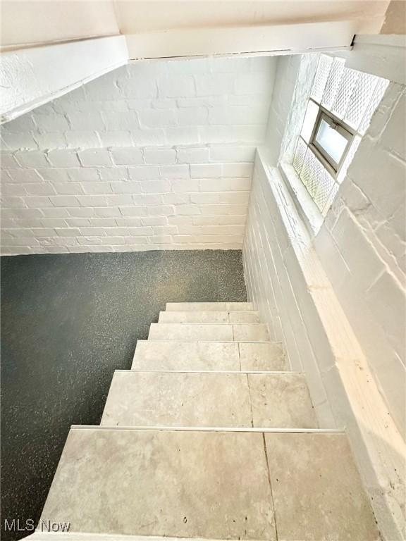 stairway with brick wall