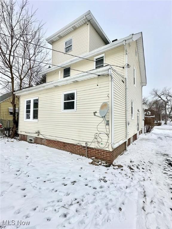 view of snow covered property