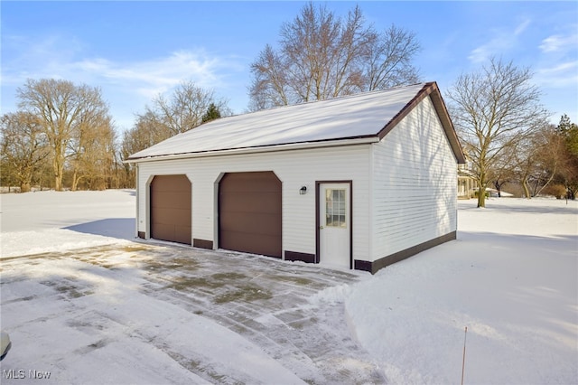 view of snow covered garage