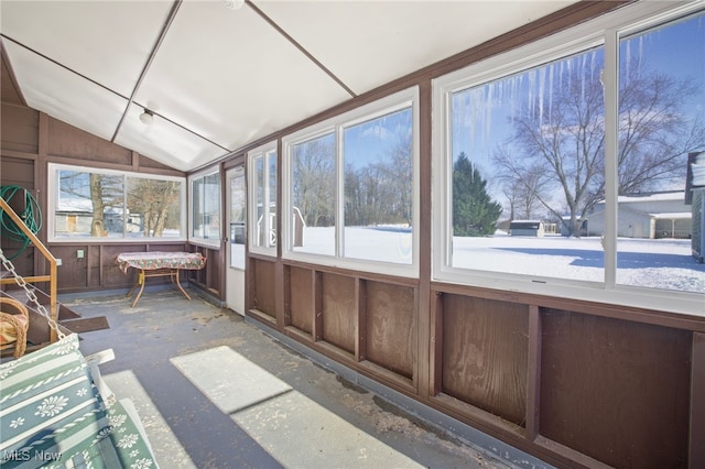 unfurnished sunroom with lofted ceiling