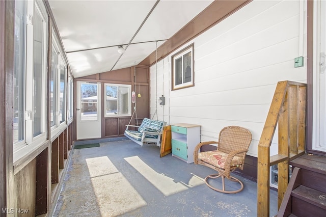 sunroom featuring vaulted ceiling