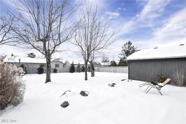 view of yard covered in snow