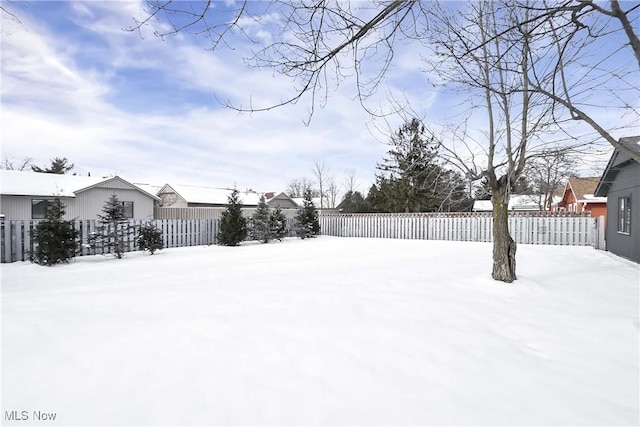 view of yard layered in snow