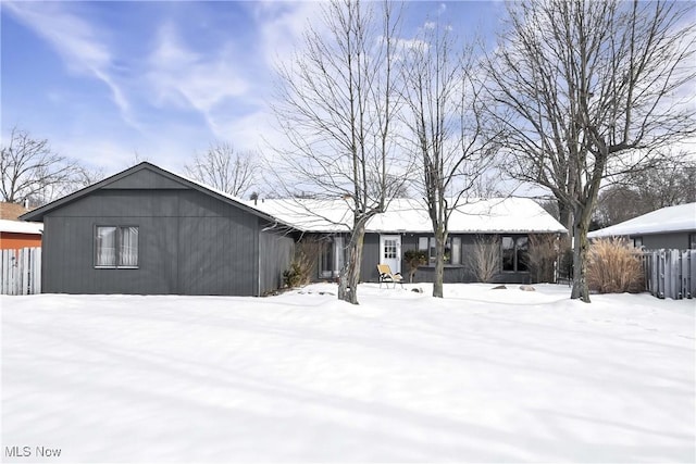 view of snow covered house