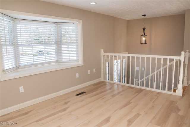 empty room with wood-type flooring