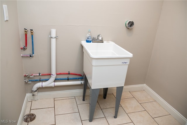 interior space featuring tile patterned flooring and sink