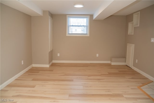 basement featuring light hardwood / wood-style flooring