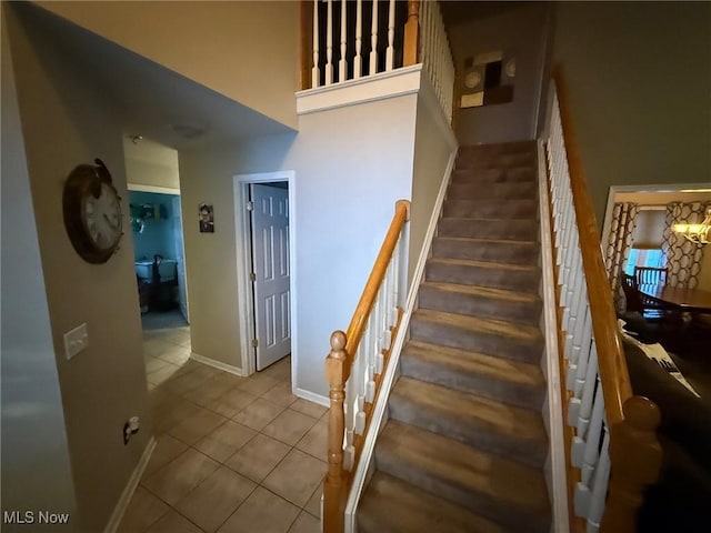 stairs with tile patterned floors