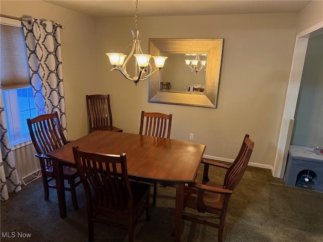 carpeted dining space featuring a notable chandelier