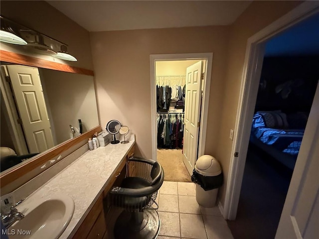 bathroom featuring tile patterned flooring and vanity