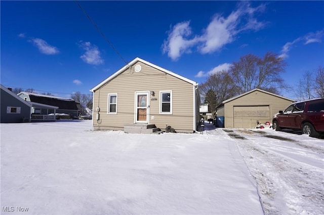 bungalow with an outbuilding and a garage