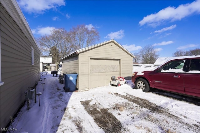 view of snow covered garage