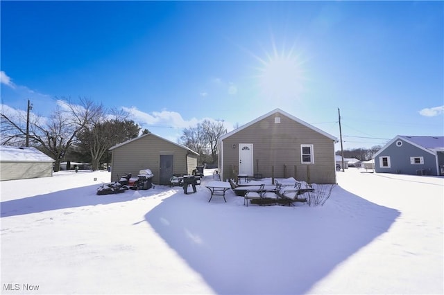 view of snow covered house