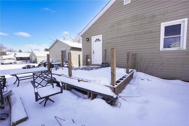 view of snow covered deck