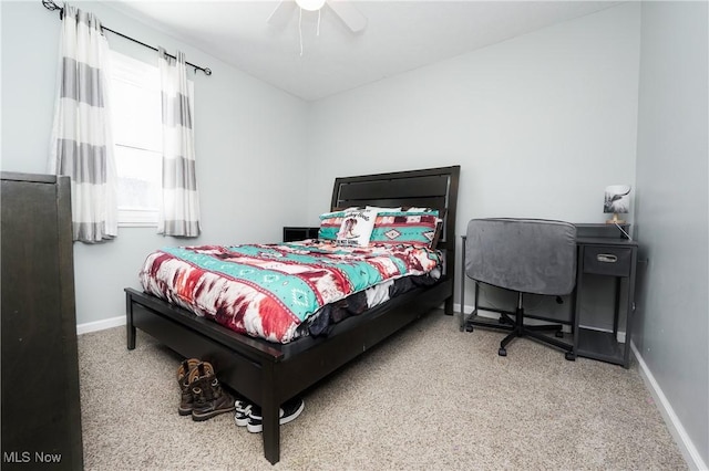 bedroom with ceiling fan and carpet