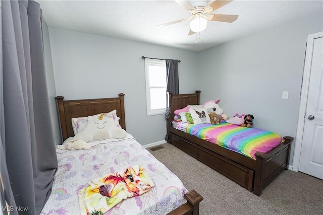 bedroom with ceiling fan and light carpet