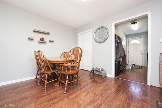 dining room featuring dark wood-type flooring