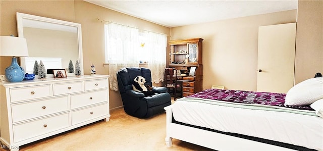 bedroom featuring light carpet