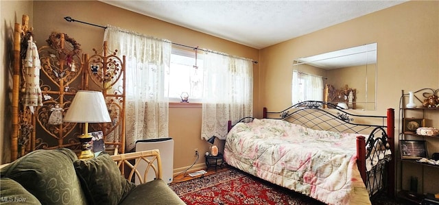 bedroom featuring multiple windows