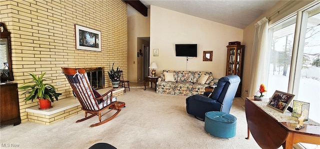 living room featuring carpet flooring, lofted ceiling with beams, and a brick fireplace