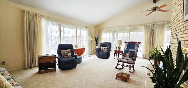 living area with ceiling fan, vaulted ceiling, and carpet