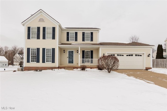 view of front of property featuring a garage and covered porch